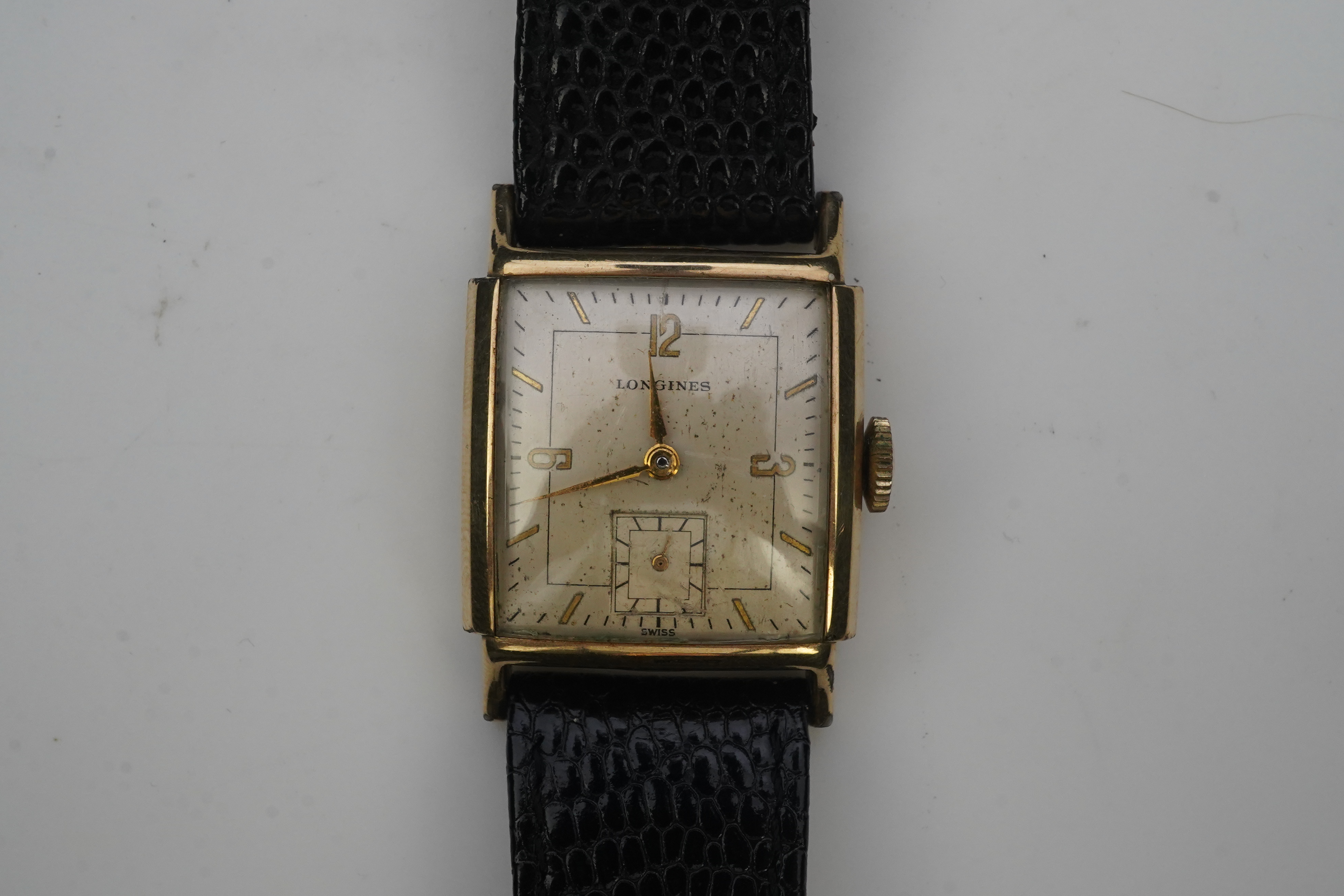 A gentleman's late 1940's gold plated Longines manual wind wrist watch, on a later associated leather strap